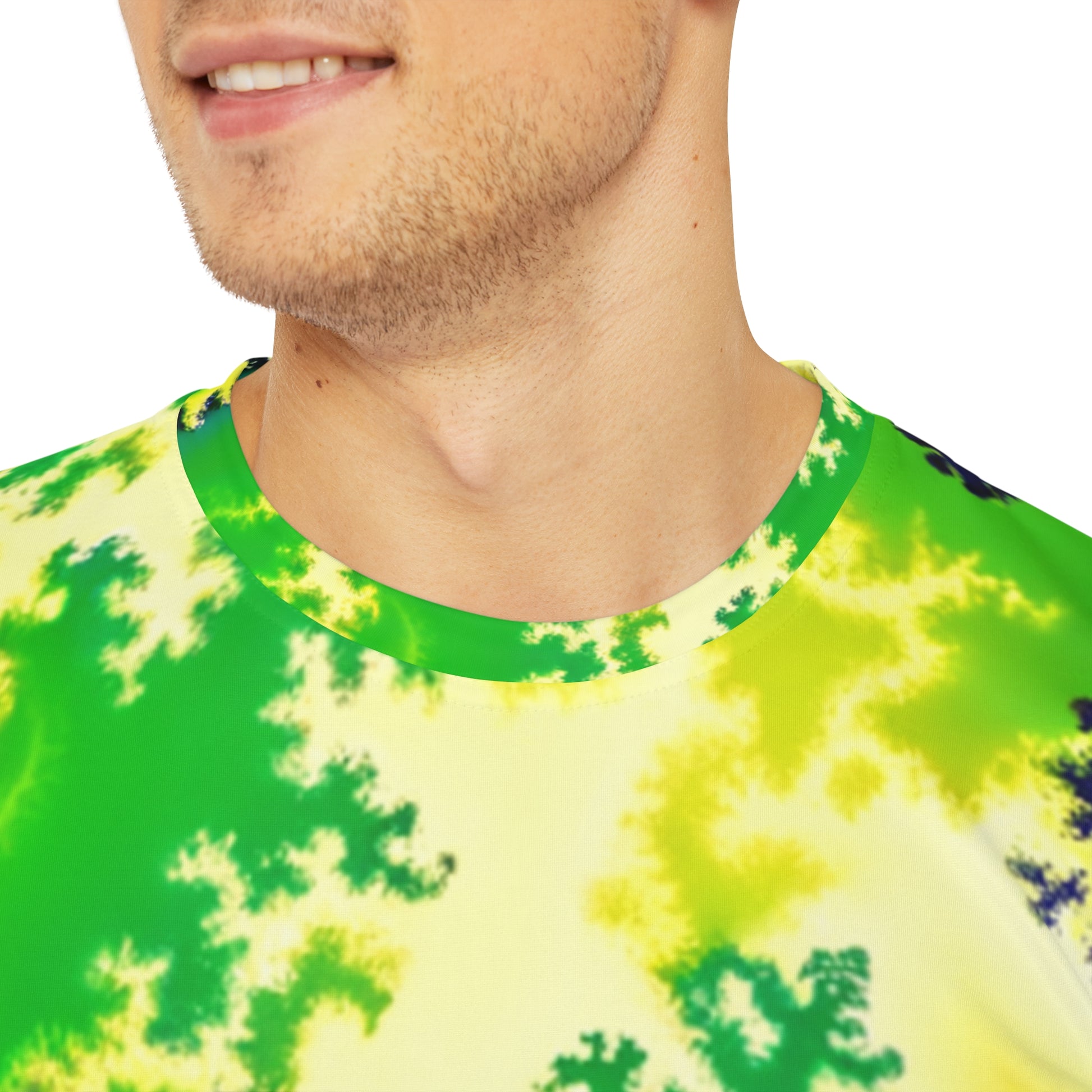 Close-up shot of the Psychedelic Serpentine Fractal Fusion Crewneck Pullover All-Over Print Short-Sleeved Shirt green yellow blue black psychedelic pattern worn by a white man