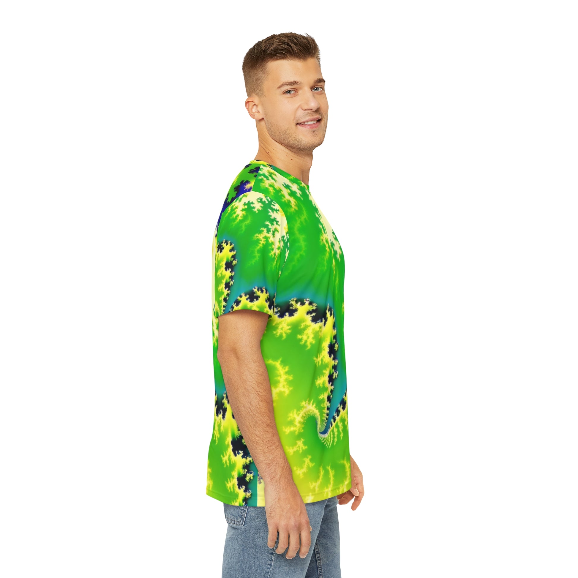 Side view of the Psychedelic Serpentine Fractal Fusion Crewneck Pullover All-Over Print Short-Sleeved Shirt green yellow blue black psychedelic pattern paired with casual denim pants worn by a white man
