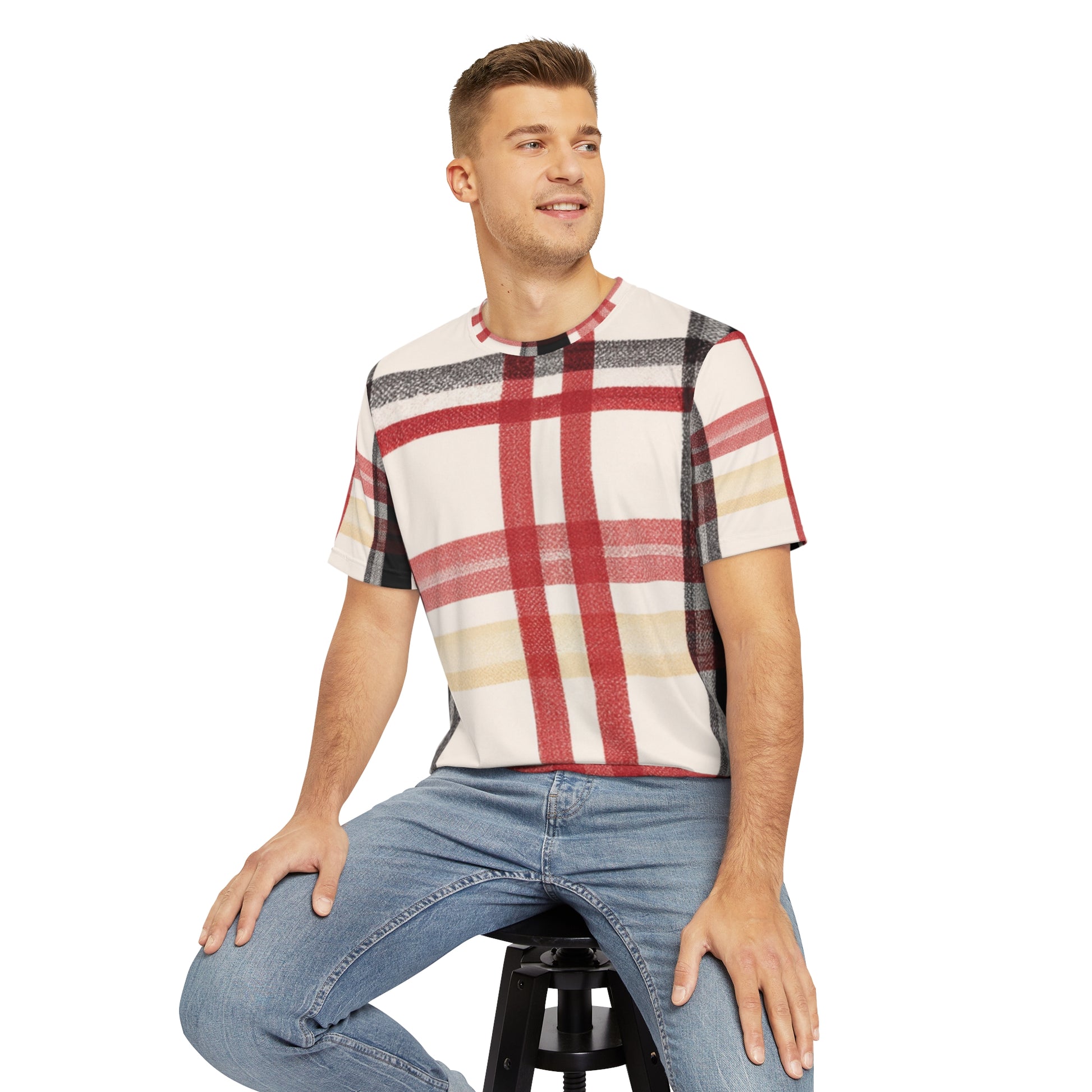 Front view of the Edinburgh Crimson Crest Tartan Crewneck Pullover All-Over Print Short-Sleeved Shirt red yellow black beige plaid pattern paired with  casual denim pants worn by a white man sitting on a stool chair