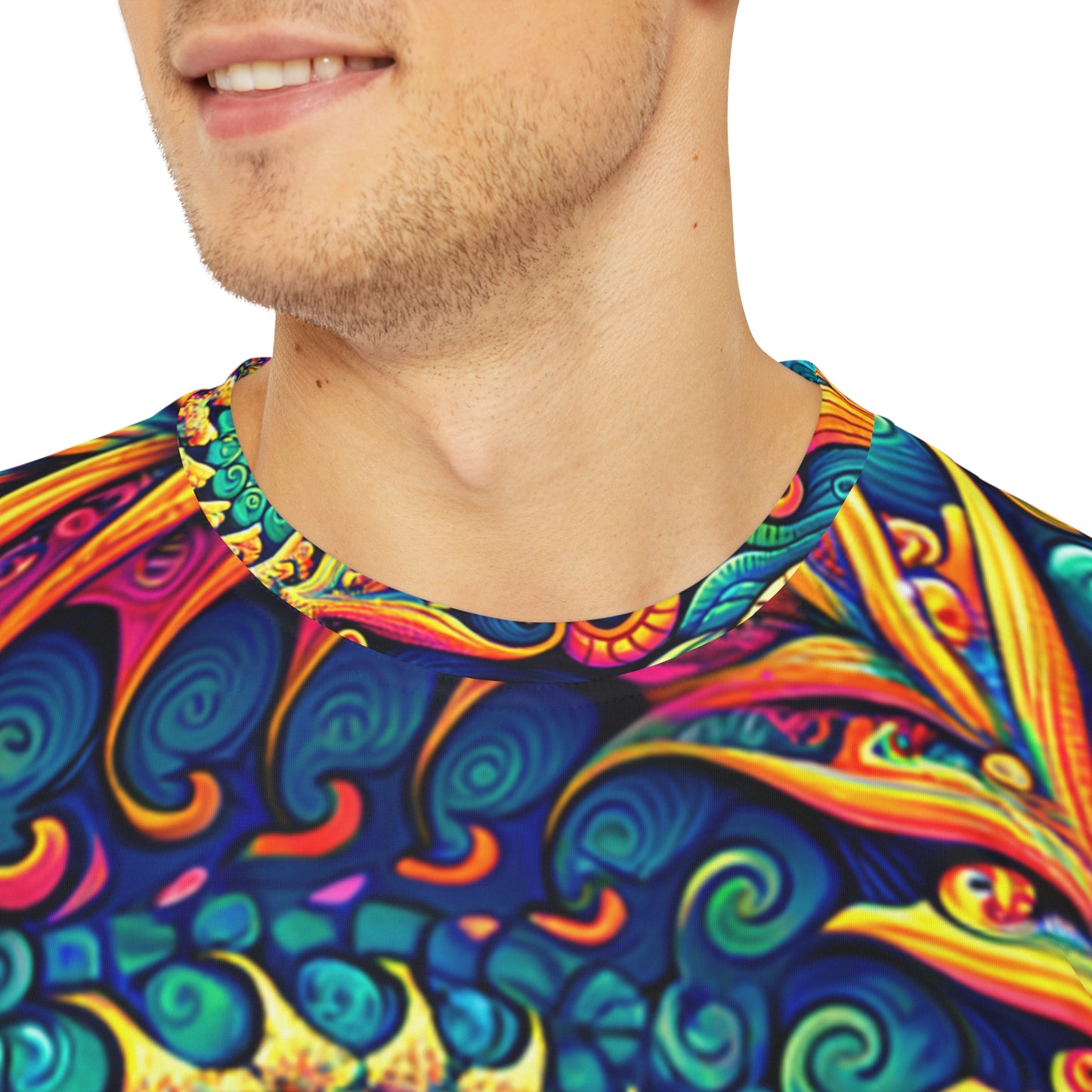 Close-up shot of the Psychedelic Peacock Swirls Crewneck Pullover All-Over Print Short-Sleeved Shirt yellow blue green red peacock swirl pattern worn by a white man