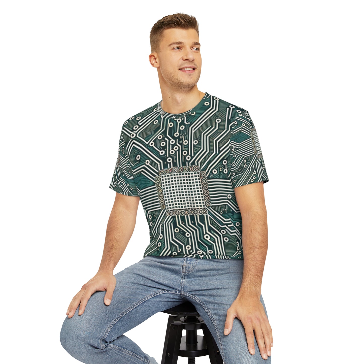 Front view of the Circuit Symmetry Matrix Crewneck Pullover All-Over Print Short-Sleeved Shirt green gray black beige circuit pattern paired with casual denim pants worn by a white man sitting on a stool chair 