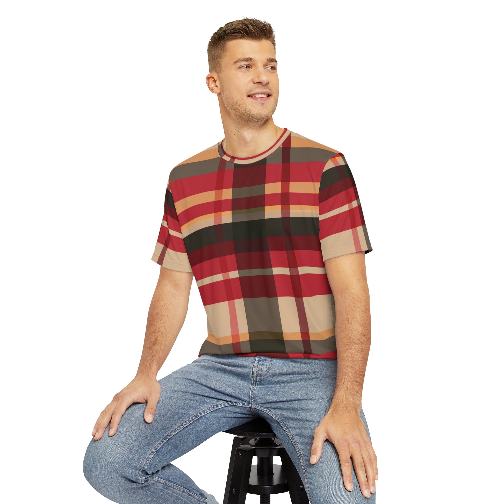 Front view of the McCloud Mist Tartan Crewneck Pullover Short-Sleeved All-Over Print Shirt red black and beige plaid pattern worn by a white male sitting on a stool chair, paired with casual denim jeans