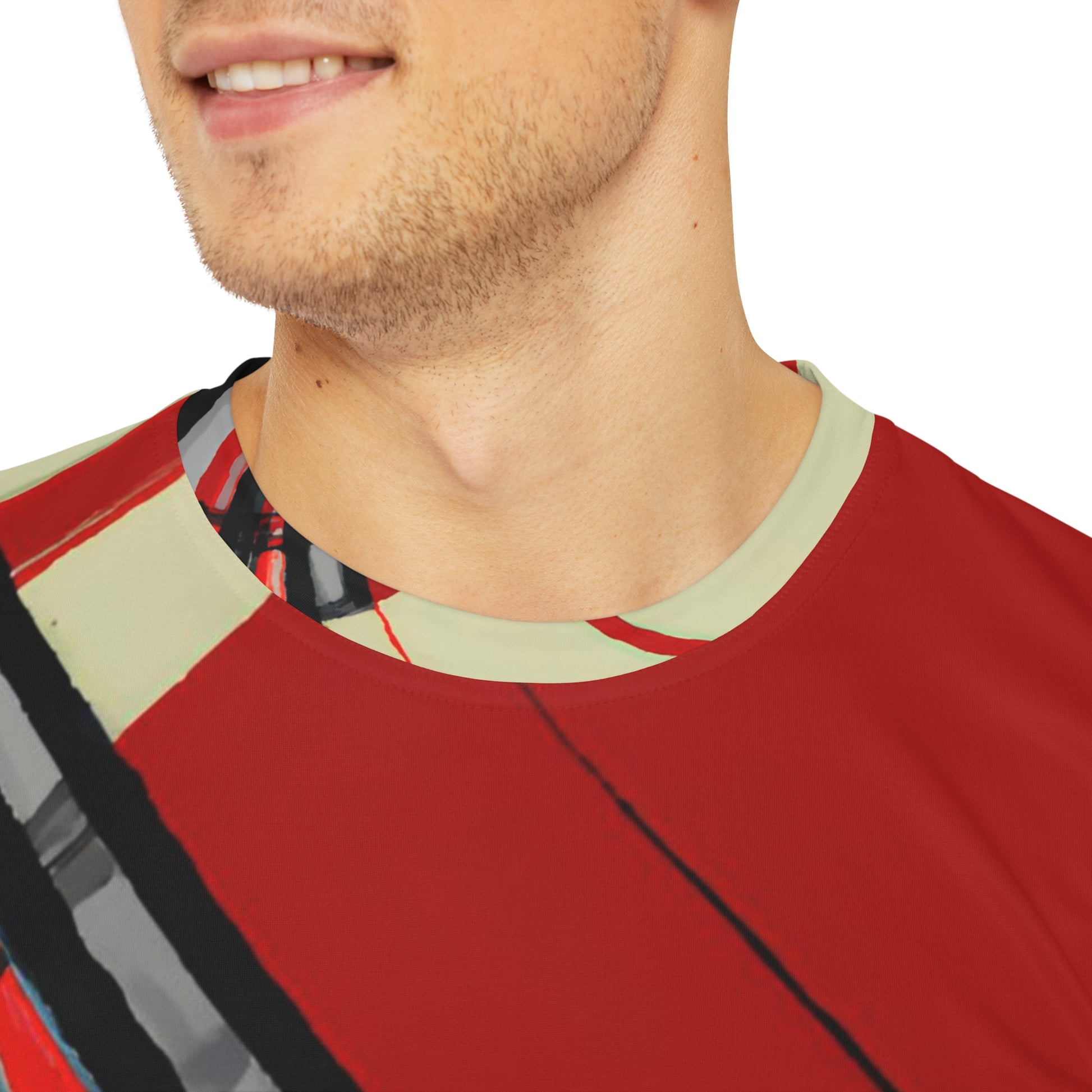 Close-up shot of  the Highland Lancer Veil Crewneck Pullover All-Over Print Short-Sleeved Shirt red black gray beige plaid pattern worn by a white man