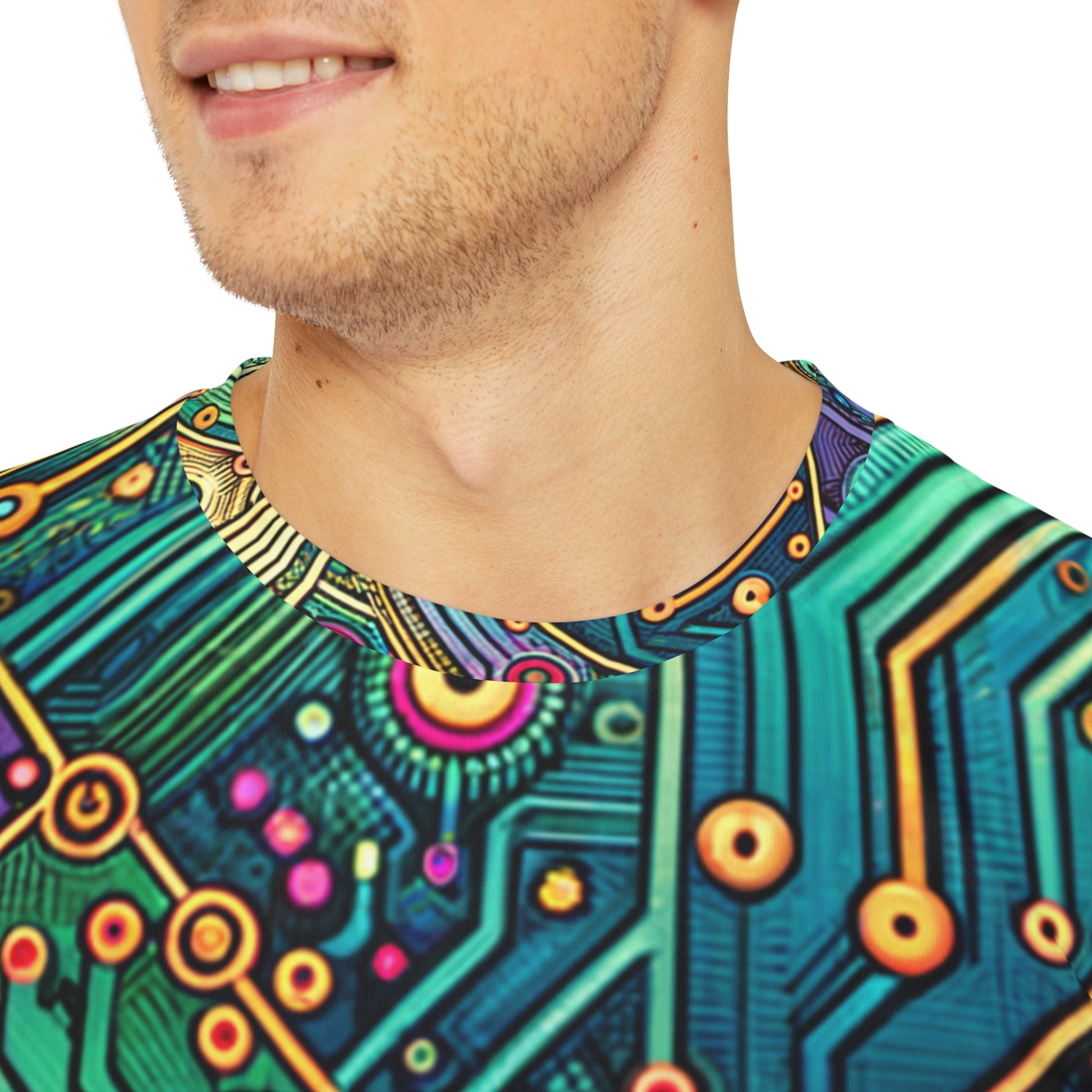 Close-up shot of the Circuit Synapse Fiesta Crewneck Pullover All-Over Print Short-Sleeved Shirt circuit print pattern green blue yellow red black white blast of colors worn by a white man