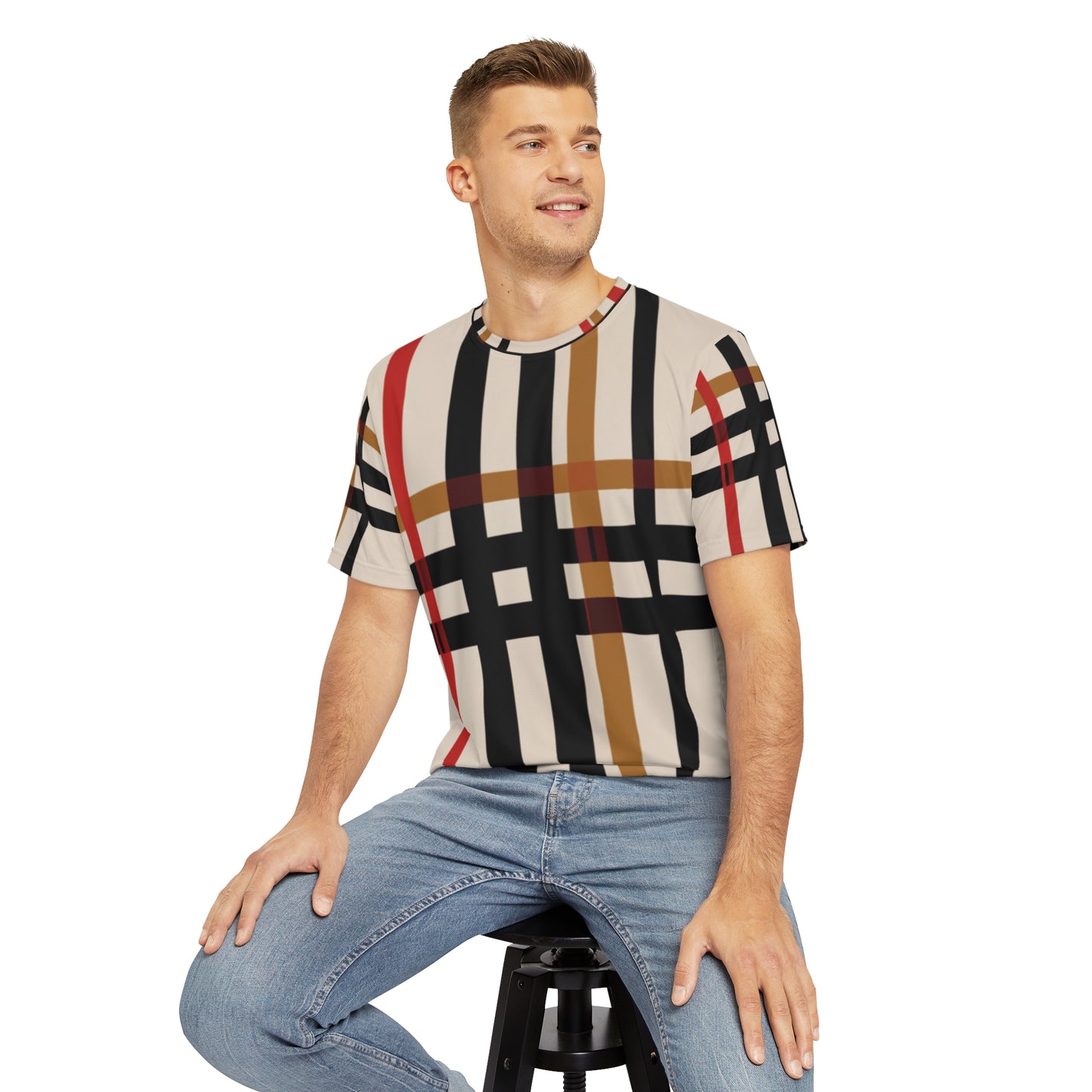Front view of the Highland Ember Dawn Crewneck Pullover All-Over Print Short-Sleeved Shirt black red mustard yellow beige plaid pattern paired with casual denim jeans worn by white man sitting on a stool chair