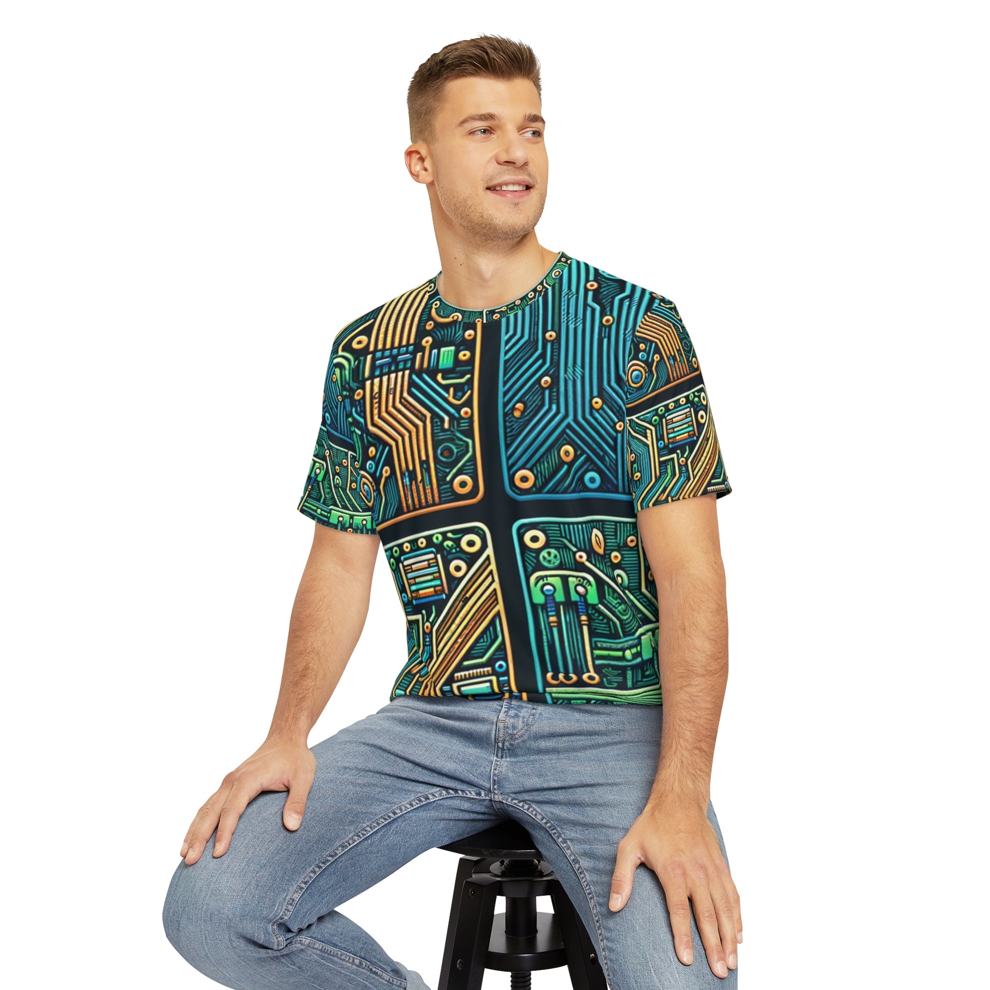 Front view of the Circuit Synapse Array Crewneck Pullover All-Over Print Short-Sleeved Shirt blue green yellow black white circuit pattern paired with casual denim pants worn by a white man sitting on a stool chair