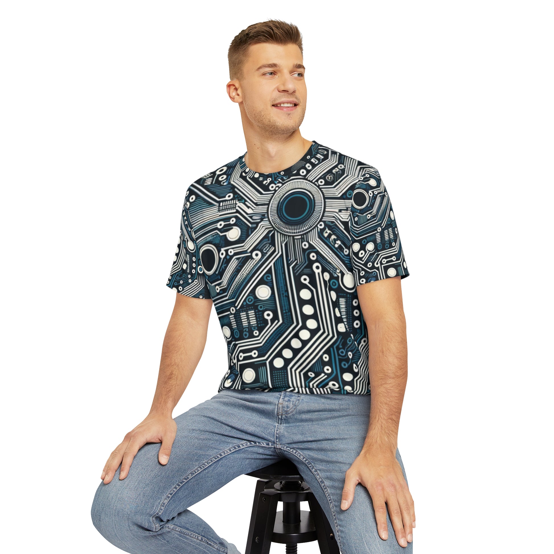 Front view of the Circuit Board Symphony Blue Crewneck Pullover All-Over Print Short-Sleeved Shirt blue black beige circuit pattern print paired with casual denim pants worn by a white man sitting on a stool chair